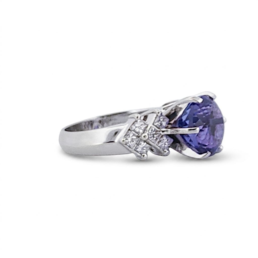 Natural Round Modified Brilliant Cut, Bluish Violet Tanzanite (5.25 CT - 10.20 mm) with 12 Natural Princess cut 3x3 mm Square Diamonds (1.92 CTW) Ring 14K White Gold. GIA Certified (2231466864).