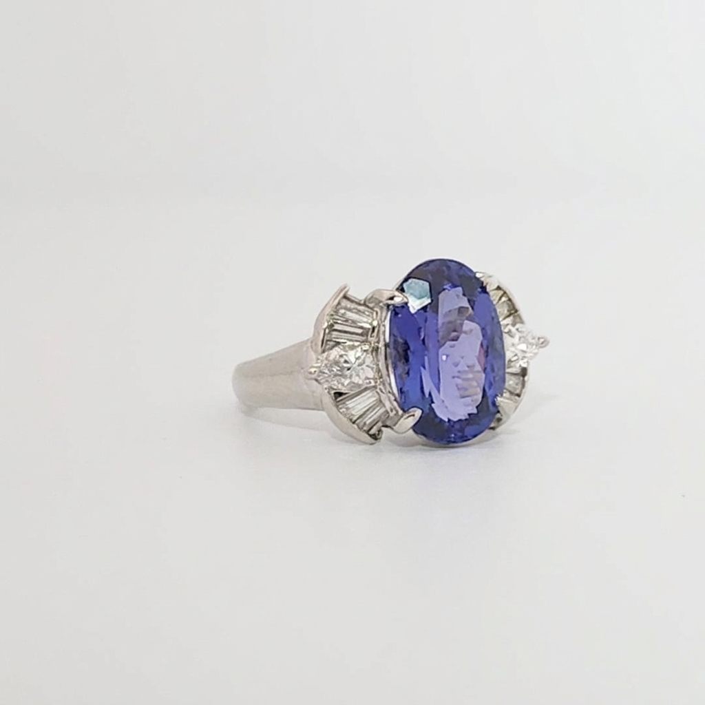 Modified Brilliant Cut, Oval Shape, Bluish Violet Tanzanite (4.38CT, 12.77 x 8.29 x 5.57 mm), Mounted at Platinum 900 Ring with Natural Diamonds (0.60 CTW, E/F-VS). GIA Certified (5232466621). Size 5.75