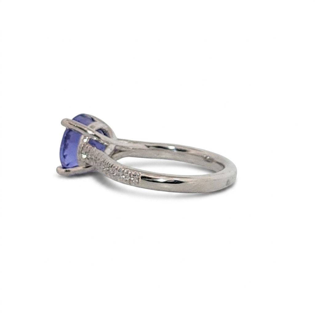 Modified Brilliant Cut, Round Shape, Bluish Violet Tanzanite (2.80CT, 8.89 - 9.01 x 5.53 mm), Mounted at Platinum 950 ring with Natural Diamonds (0.18 CTW E/F-SI). GIA Certified (5231466569). Size 5.25