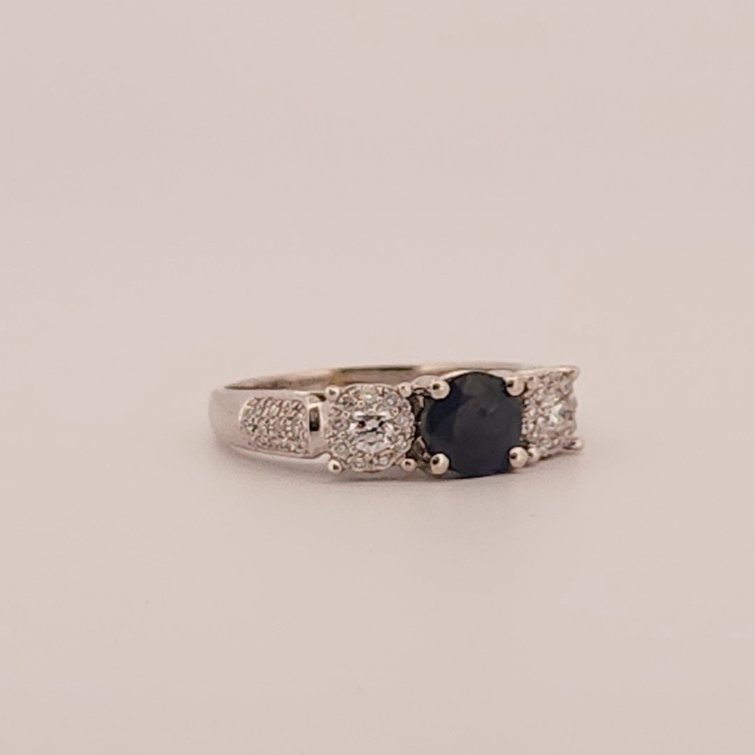 Three stone style Bridal Ring with 0.75 CT Natural Sapphire and 0.34CTW Natural Diamonds