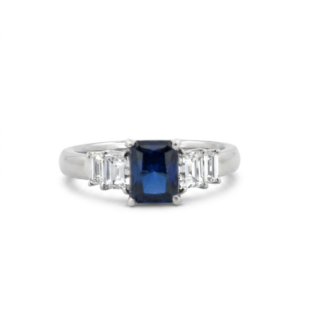 Emerald Step-Cut, AAA Natural Blue Sapphire (1.15CT, 7x5mm), Mounted on Platinum 900 Ring with Natural Diamonds (0.77 CTW, E/F VS1/VS2). Size 7.25