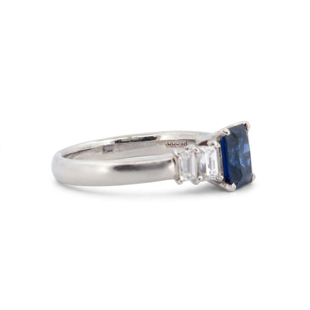 Emerald Step-Cut, AAA Natural Blue Sapphire (1.15CT, 7x5mm), Mounted on Platinum 900 Ring with Natural Diamonds (0.77 CTW, E/F VS1/VS2). Size 7.25