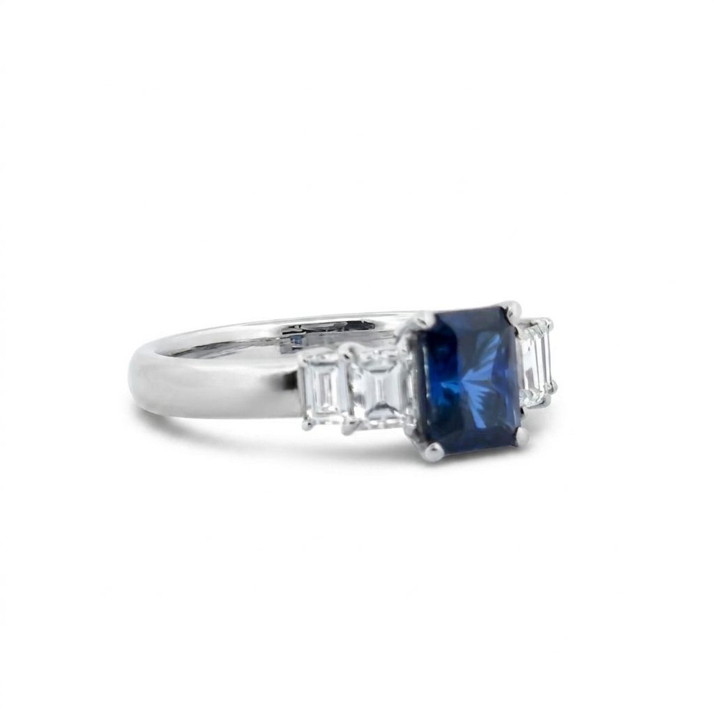 Emerald Step-Cut, AAA Natural Blue Sapphire (1.15CT, 7x5mm), Mounted on Platinum 900 Ring with Natural Diamonds (0.77 CTW, E/F VS1/VS2). Size 7.25