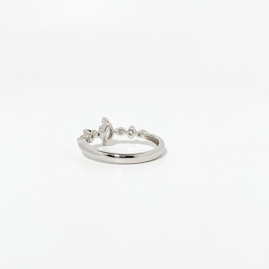 Platinum 900 Engagement Ring, size 6, set with 1 Marquise Diamond (0.28ct, I, SI2) and 6 Round Diamonds (0.15ct total, G, SI1).