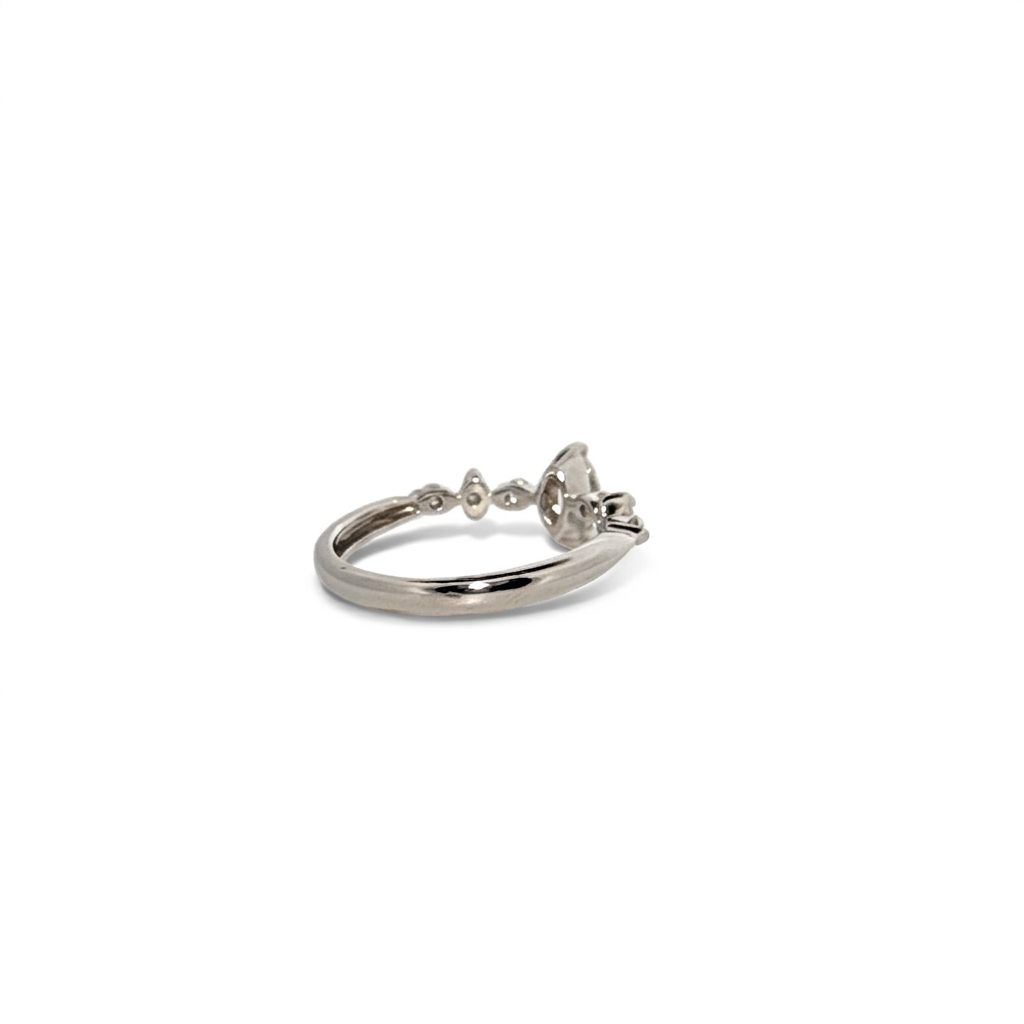 Platinum 900 Engagement Ring, size 6, set with 1 Marquise Diamond (0.28ct, I, SI2) and 6 Round Diamonds (0.15ct total, G, SI1).