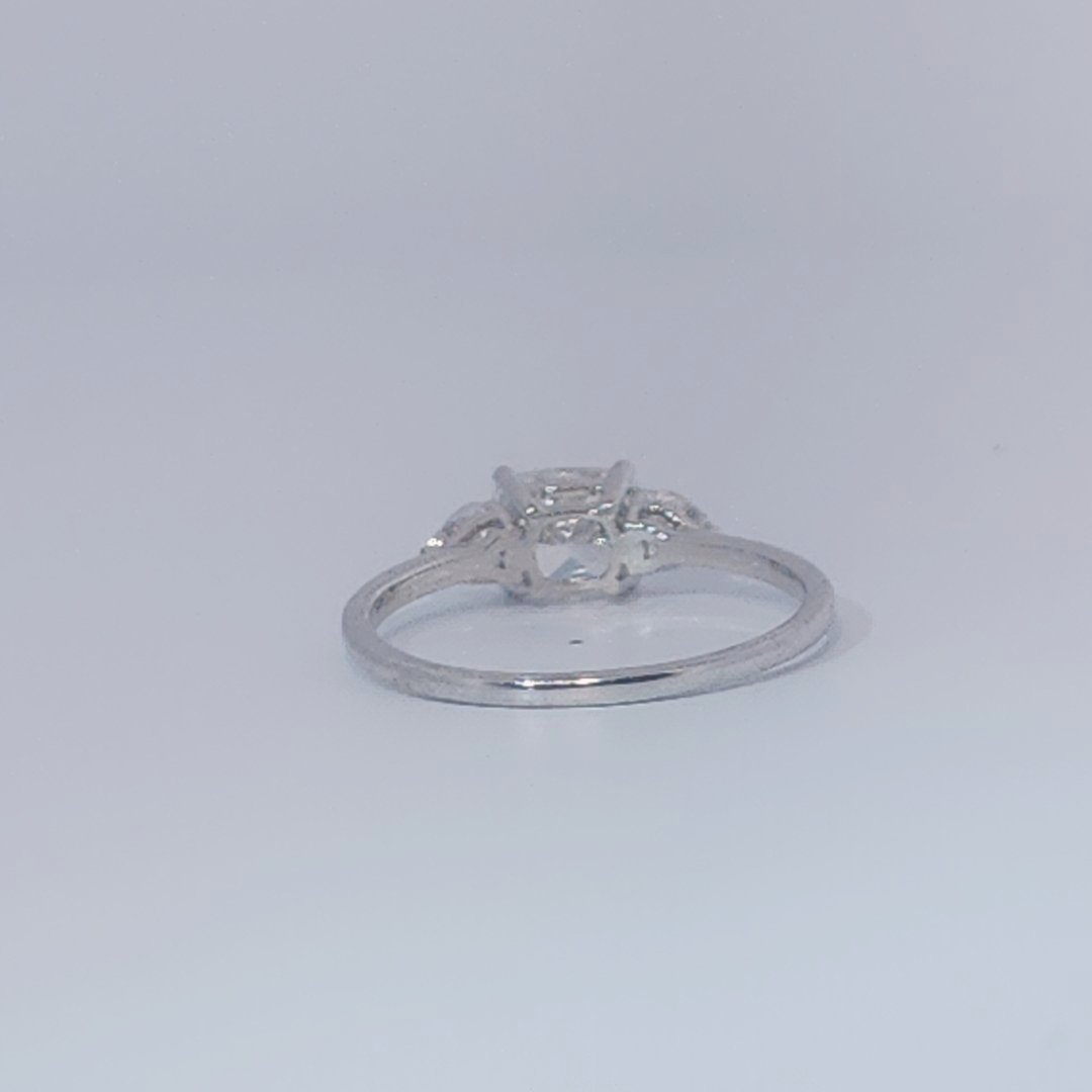 Women's Three-Stone Ring, 14K White Gold, featuring a 1.01ct D/VS2 Radiant-cut Diamond and two 0.31ct side Diamonds.