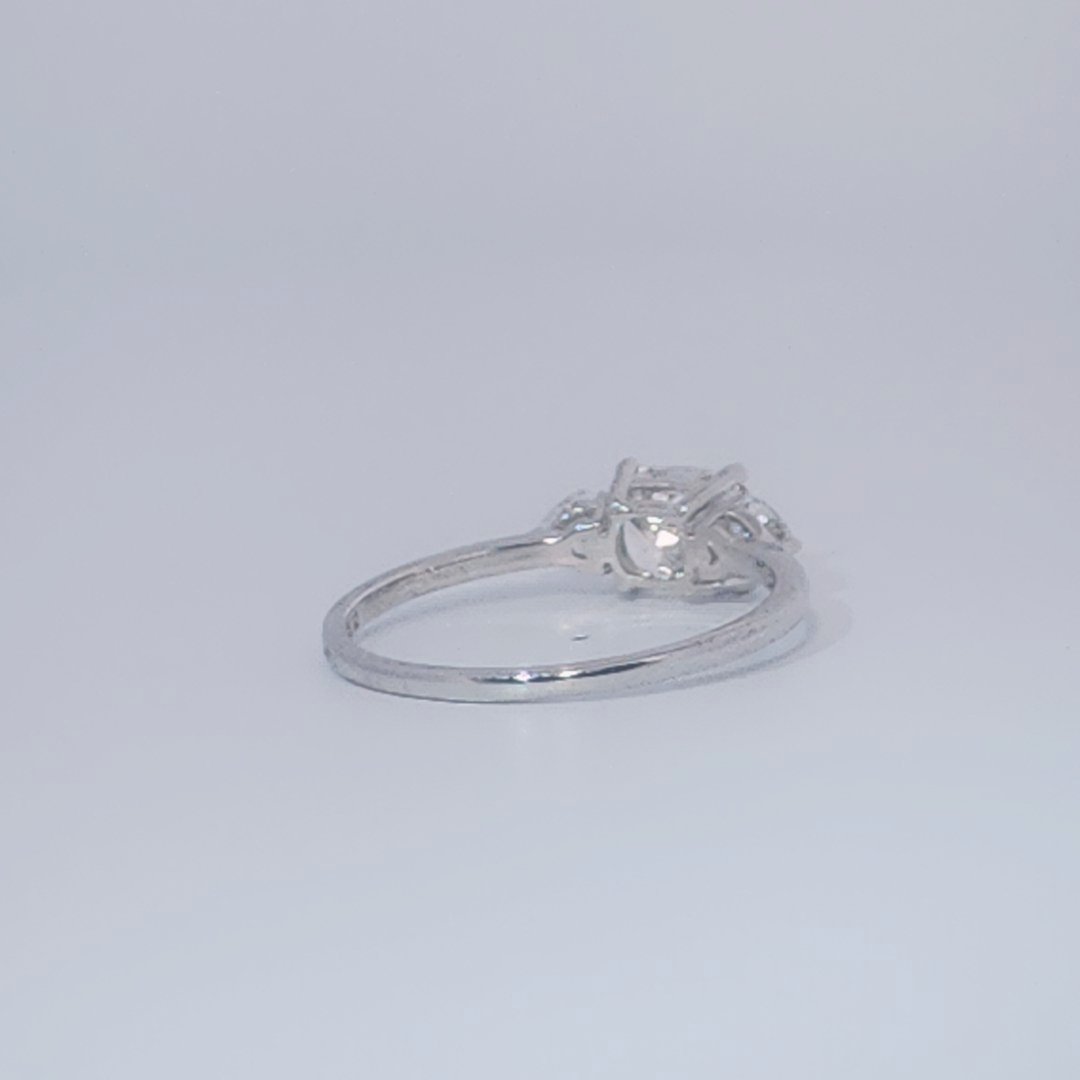 Women's Three-Stone Ring, 14K White Gold, featuring a 1.01ct D/VS2 Radiant-cut Diamond and two 0.31ct side Diamonds.