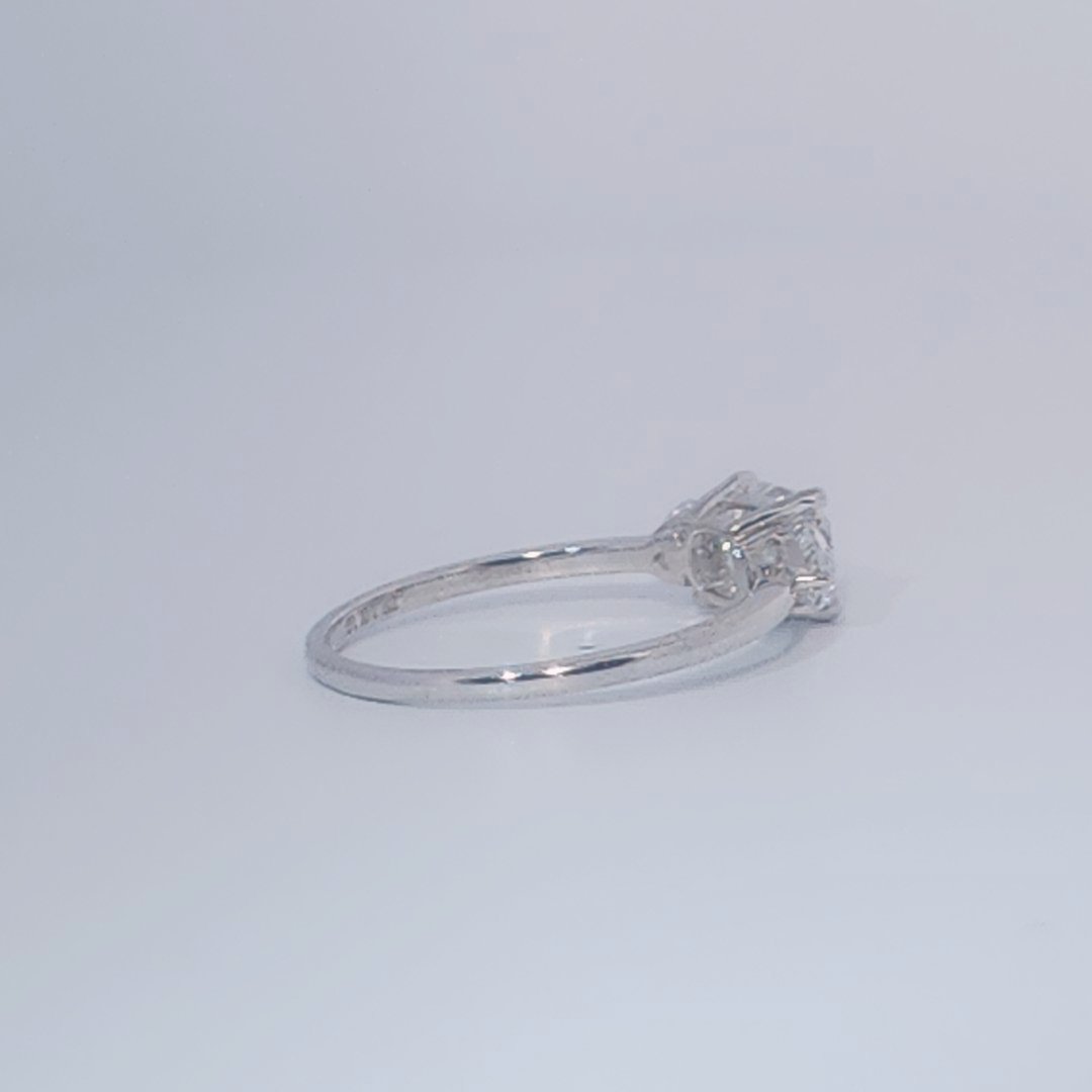 Women's Three-Stone Ring, 14K White Gold, featuring a 1.01ct D/VS2 Radiant-cut Diamond and two 0.31ct side Diamonds.