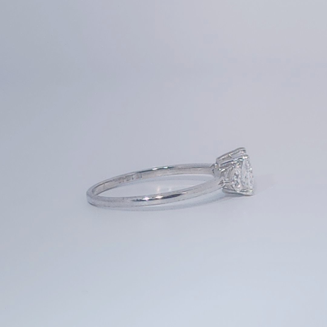 Women's Three-Stone Ring, 14K White Gold, featuring a 1.01ct D/VS2 Radiant-cut Diamond and two 0.31ct side Diamonds.