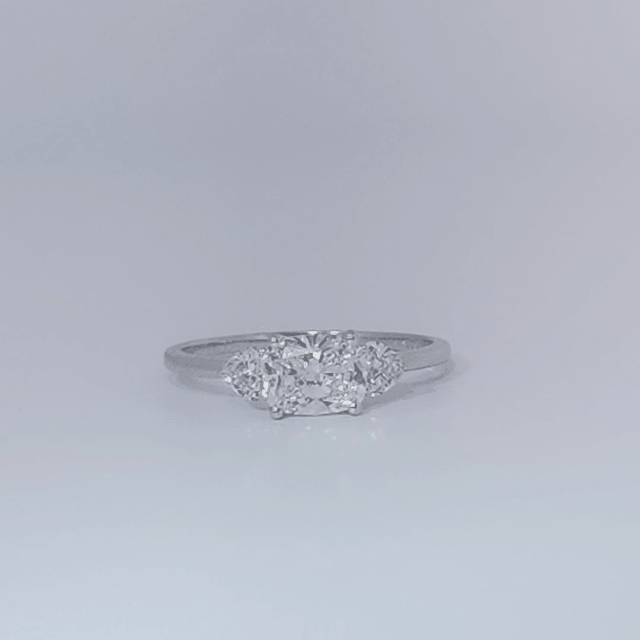 Women's Three-Stone Ring, 14K White Gold, featuring a 1.01ct D/VS2 Radiant-cut Diamond and two 0.31ct side Diamonds.