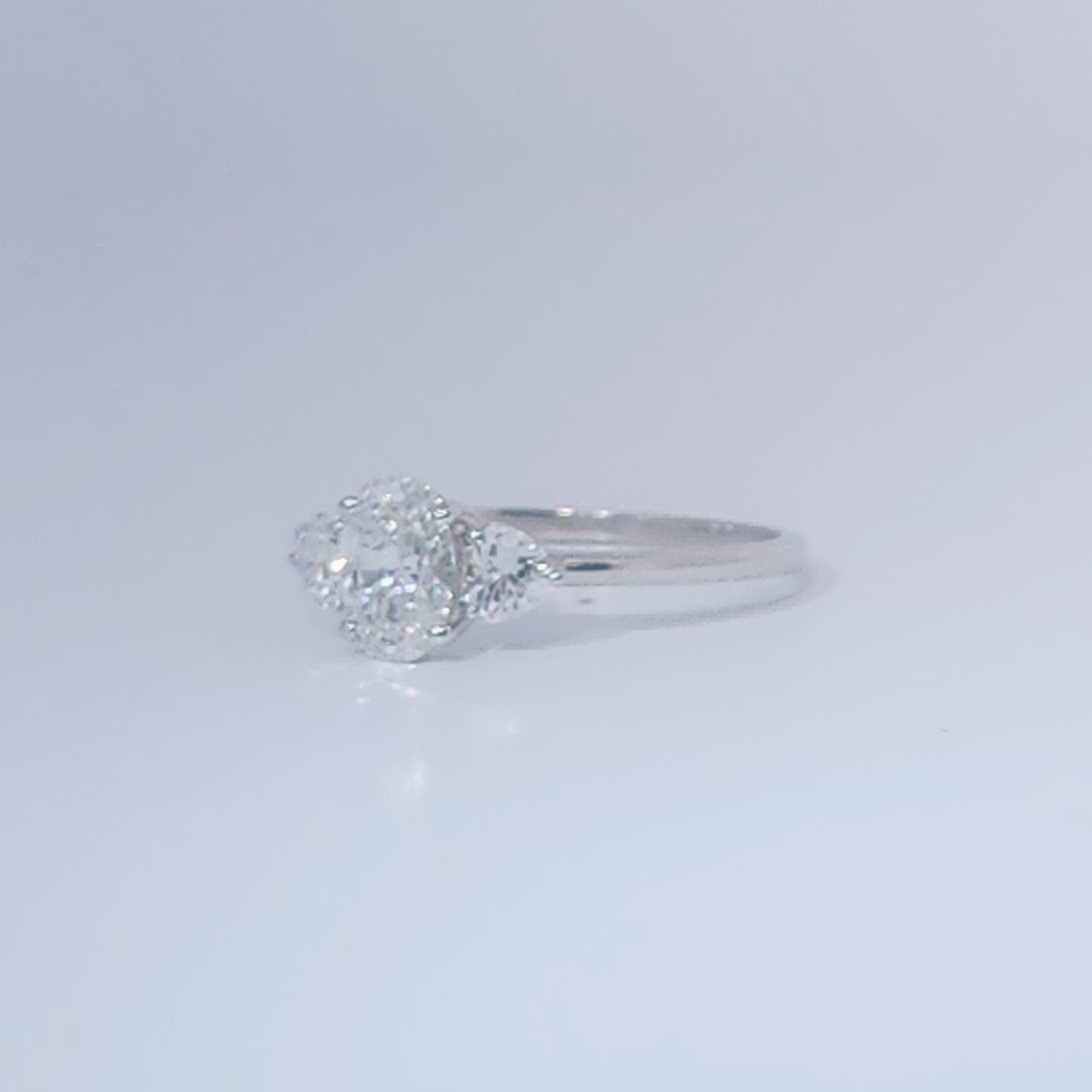 Women's 3-stone Ring in 14K White Gold with a 0.71ct D color (colorless) center Diamond and two 0.31ct F color (colorless) side Diamonds.