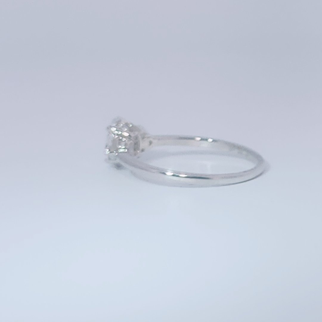 Women's 3-stone Ring in 14K White Gold with a 0.71ct D color (colorless) center Diamond and two 0.31ct F color (colorless) side Diamonds.