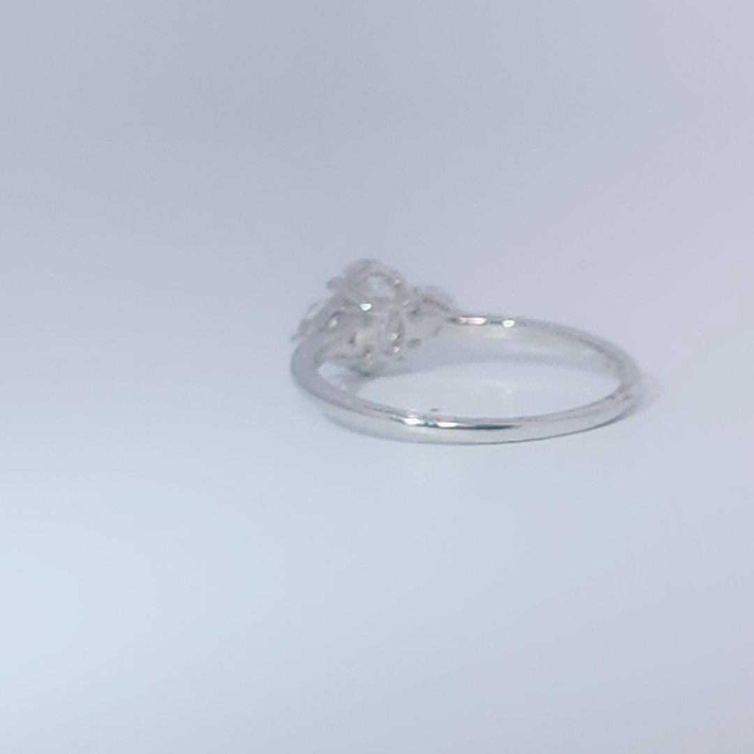 Women's 3-stone Ring in 14K White Gold with a 0.71ct D color (colorless) center Diamond and two 0.31ct F color (colorless) side Diamonds.