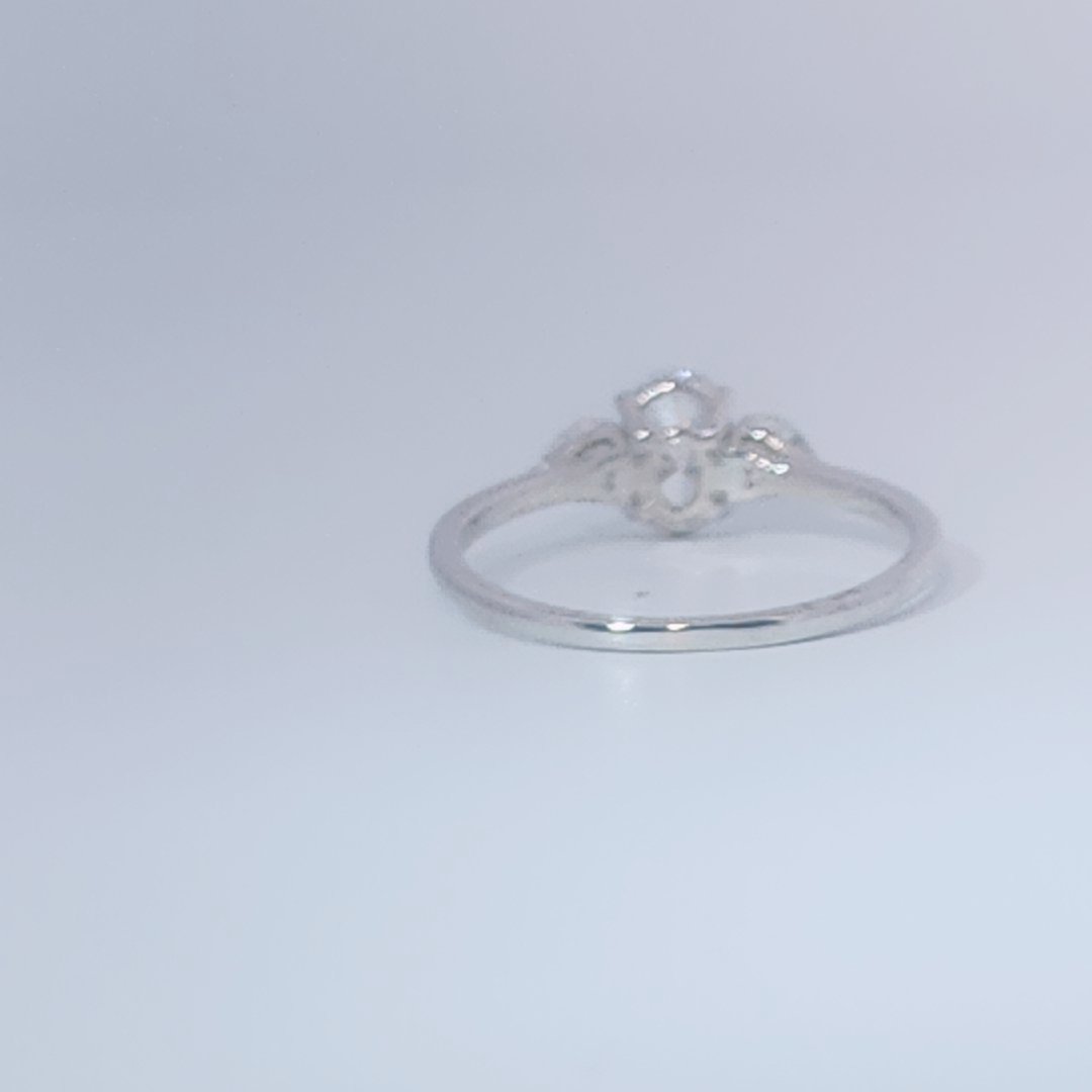 Women's 3-stone Ring in 14K White Gold with a 0.71ct D color (colorless) center Diamond and two 0.31ct F color (colorless) side Diamonds.