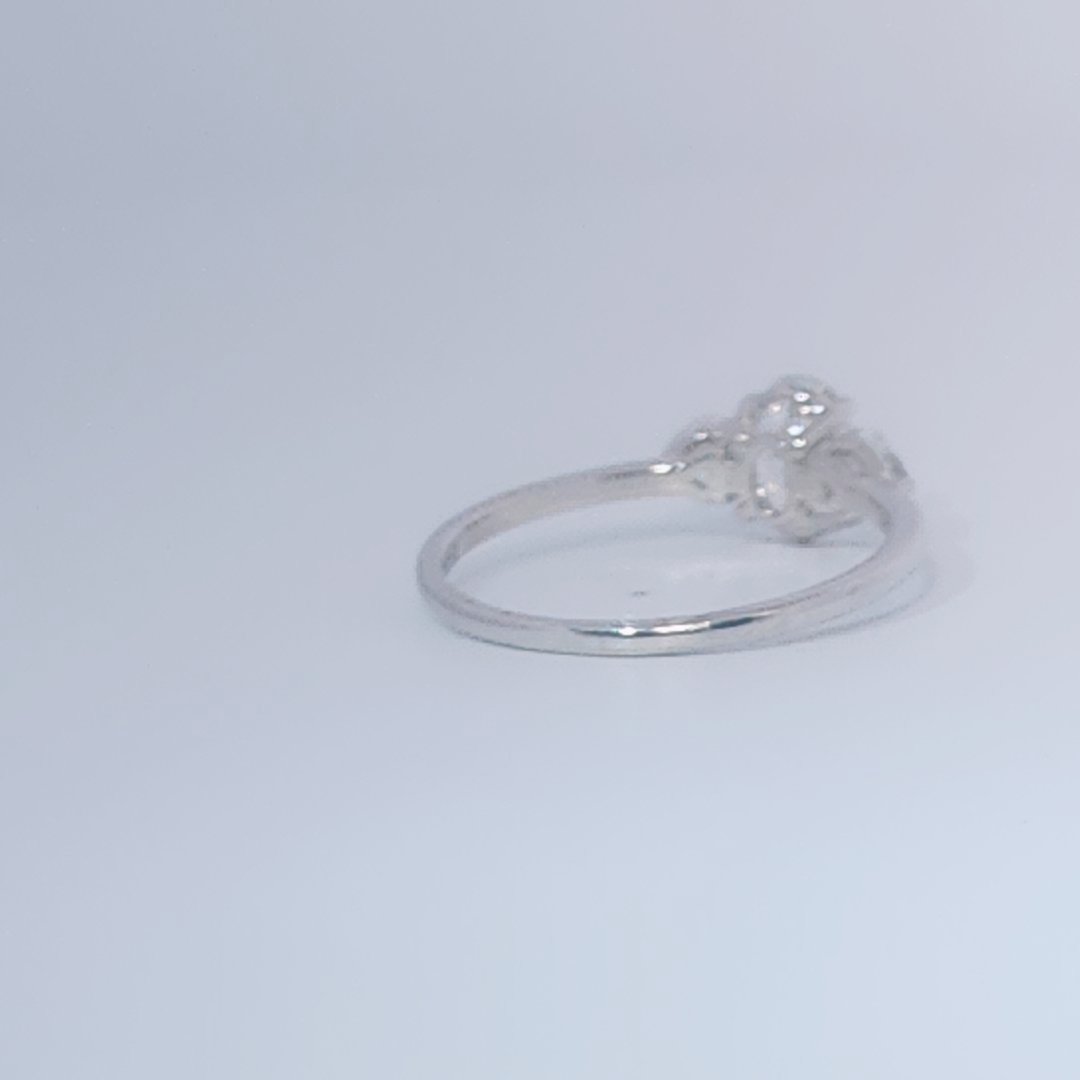 Women's 3-stone Ring in 14K White Gold with a 0.71ct D color (colorless) center Diamond and two 0.31ct F color (colorless) side Diamonds.