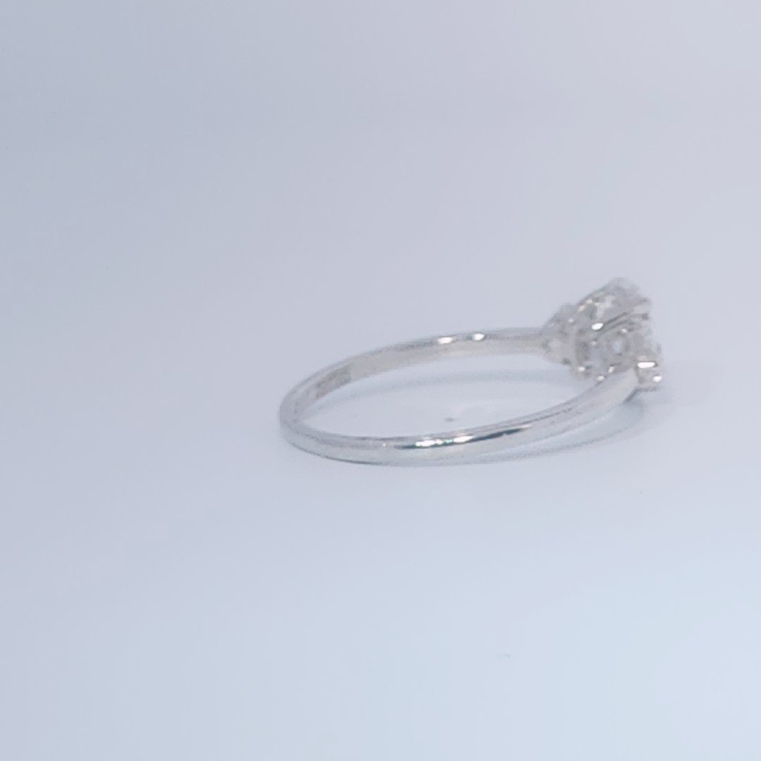 Women's 3-stone Ring in 14K White Gold with a 0.71ct D color (colorless) center Diamond and two 0.31ct F color (colorless) side Diamonds.