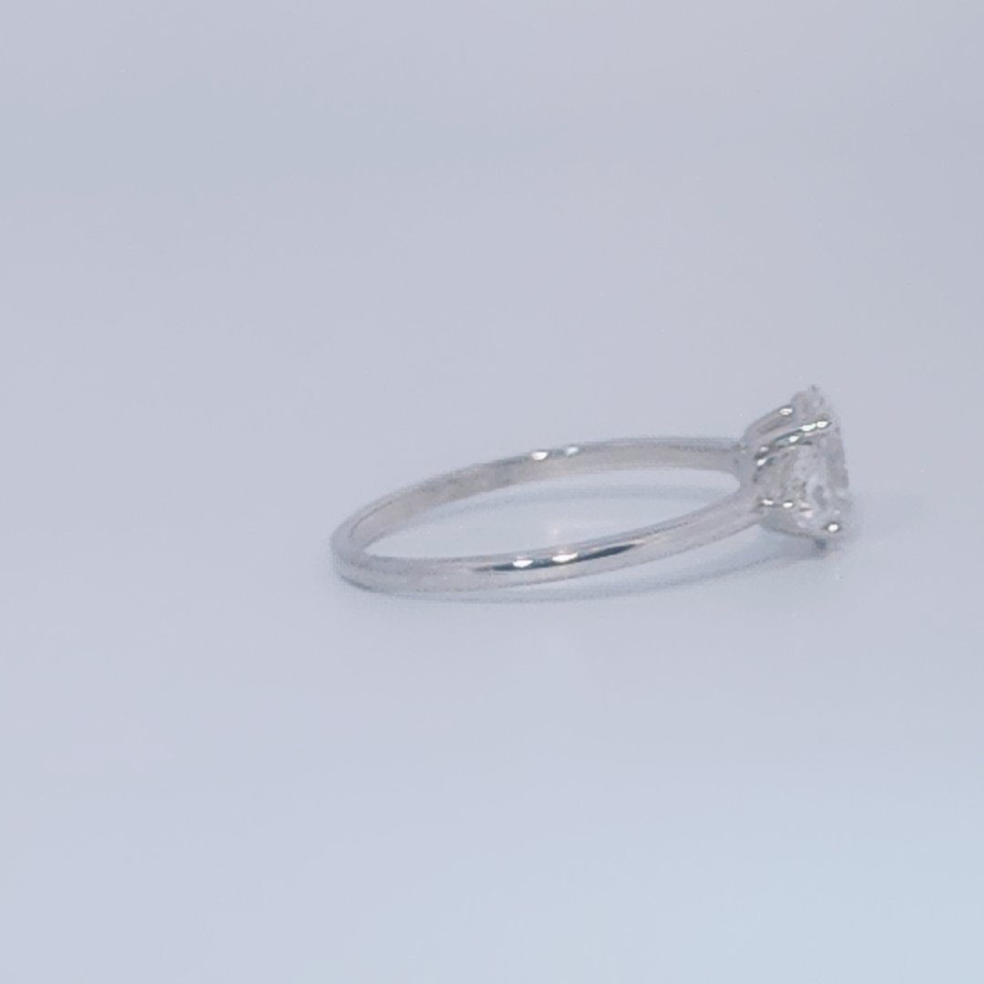 Women's 3-stone Ring in 14K White Gold with a 0.71ct D color (colorless) center Diamond and two 0.31ct F color (colorless) side Diamonds.