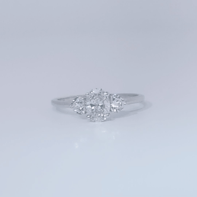Women's 3-stone Ring in 14K White Gold with a 0.71ct D color (colorless) center Diamond and two 0.31ct F color (colorless) side Diamonds.