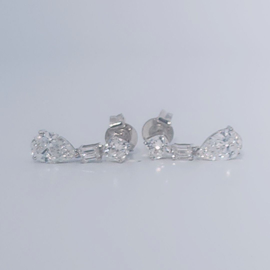 Female Diamond cluster Earrings, 2K White Gold, graduated pear and baguette-cut Diamonds totaling 1.88ct.