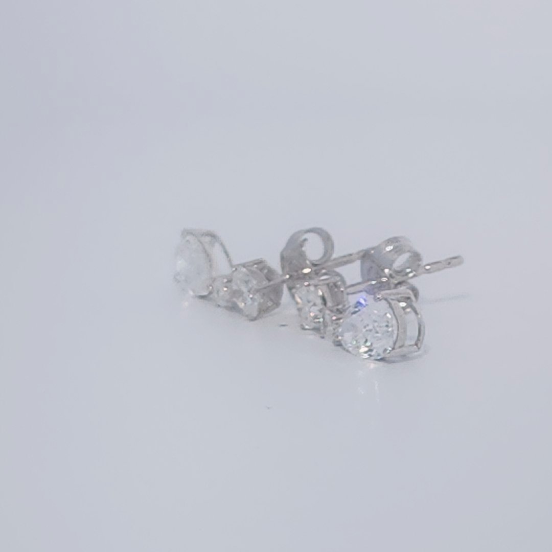 Female Diamond cluster Earrings, 2K White Gold, graduated pear and baguette-cut Diamonds totaling 1.88ct.