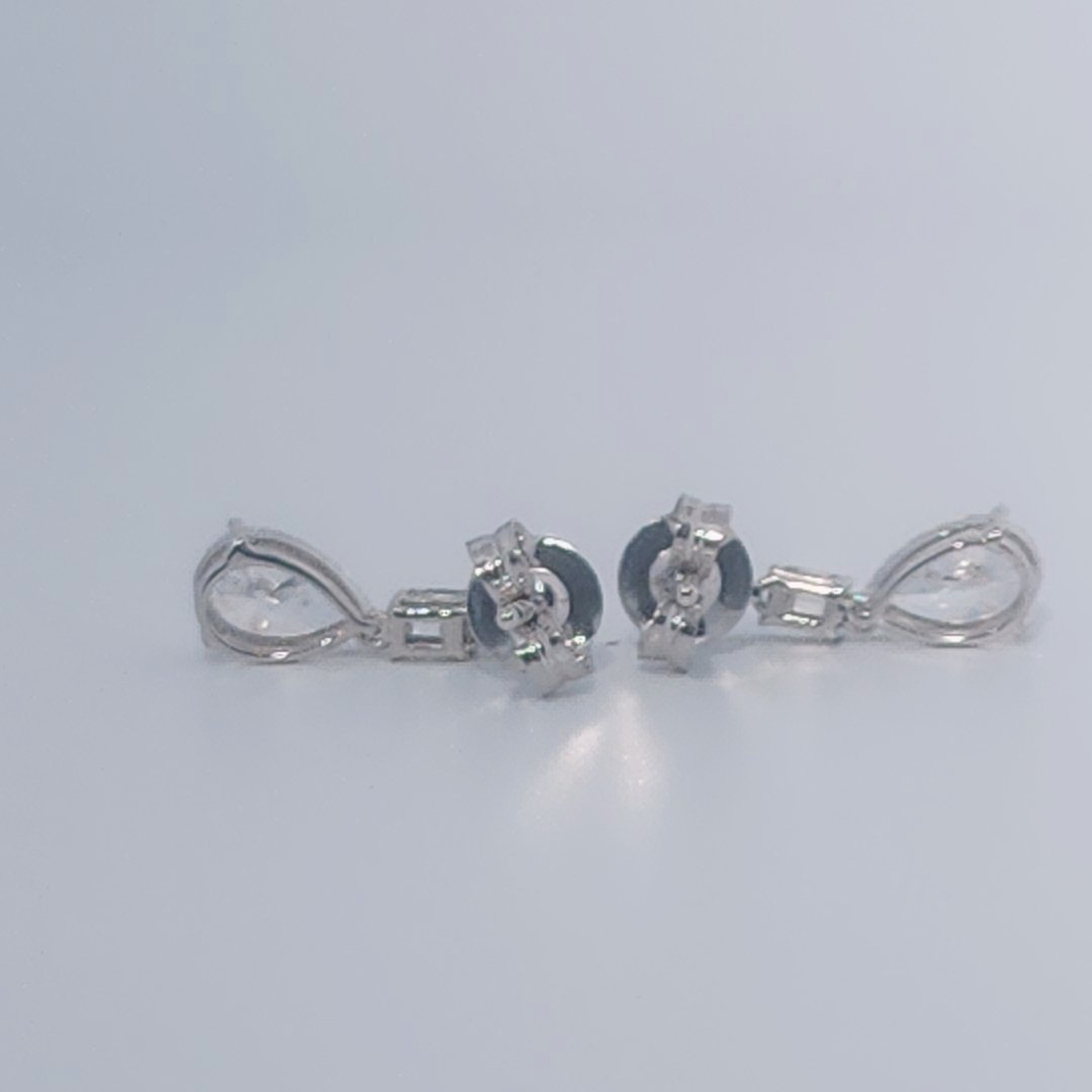 Female Diamond cluster Earrings, 2K White Gold, graduated pear and baguette-cut Diamonds totaling 1.88ct.