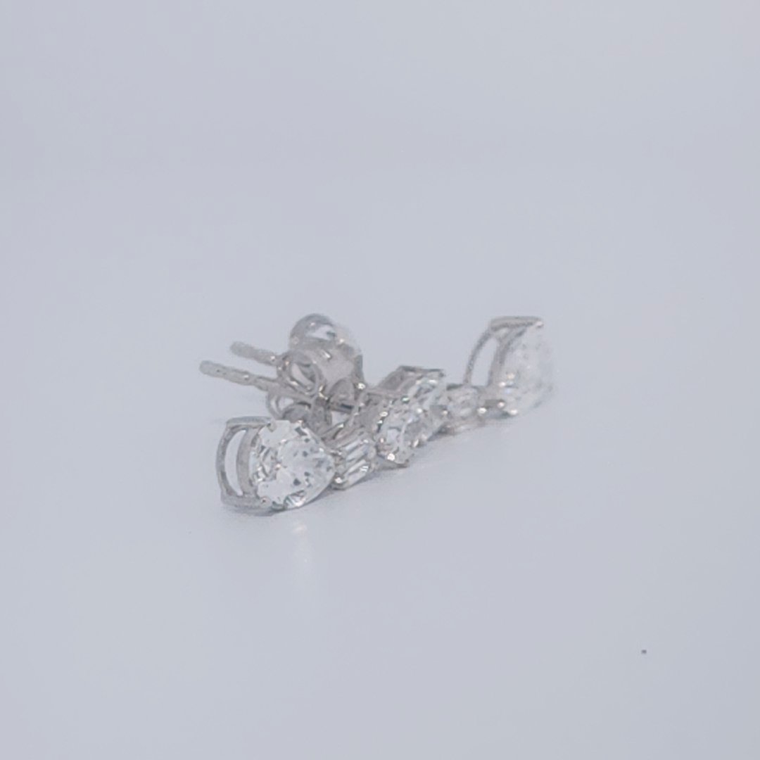 Female Diamond cluster Earrings, 2K White Gold, graduated pear and baguette-cut Diamonds totaling 1.88ct.