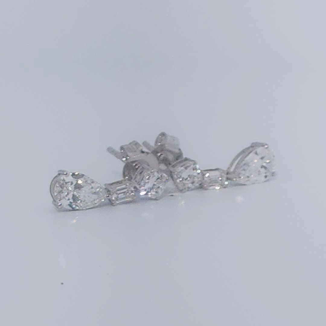 Female Diamond cluster Earrings, 2K White Gold, graduated pear and baguette-cut Diamonds totaling 1.88ct.