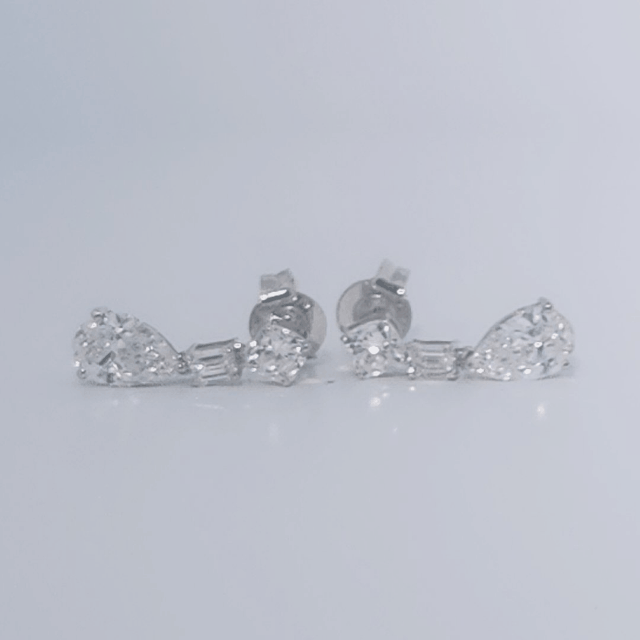 Female Diamond cluster Earrings, 2K White Gold, graduated pear and baguette-cut Diamonds totaling 1.88ct.