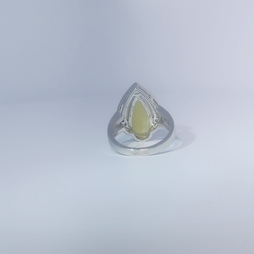 Women's Teardrop Ring in 925 Sterling Silver featuring a pear-shaped yellow-green Jade center stone accentuated by a delicate halo of small, bright stones.
