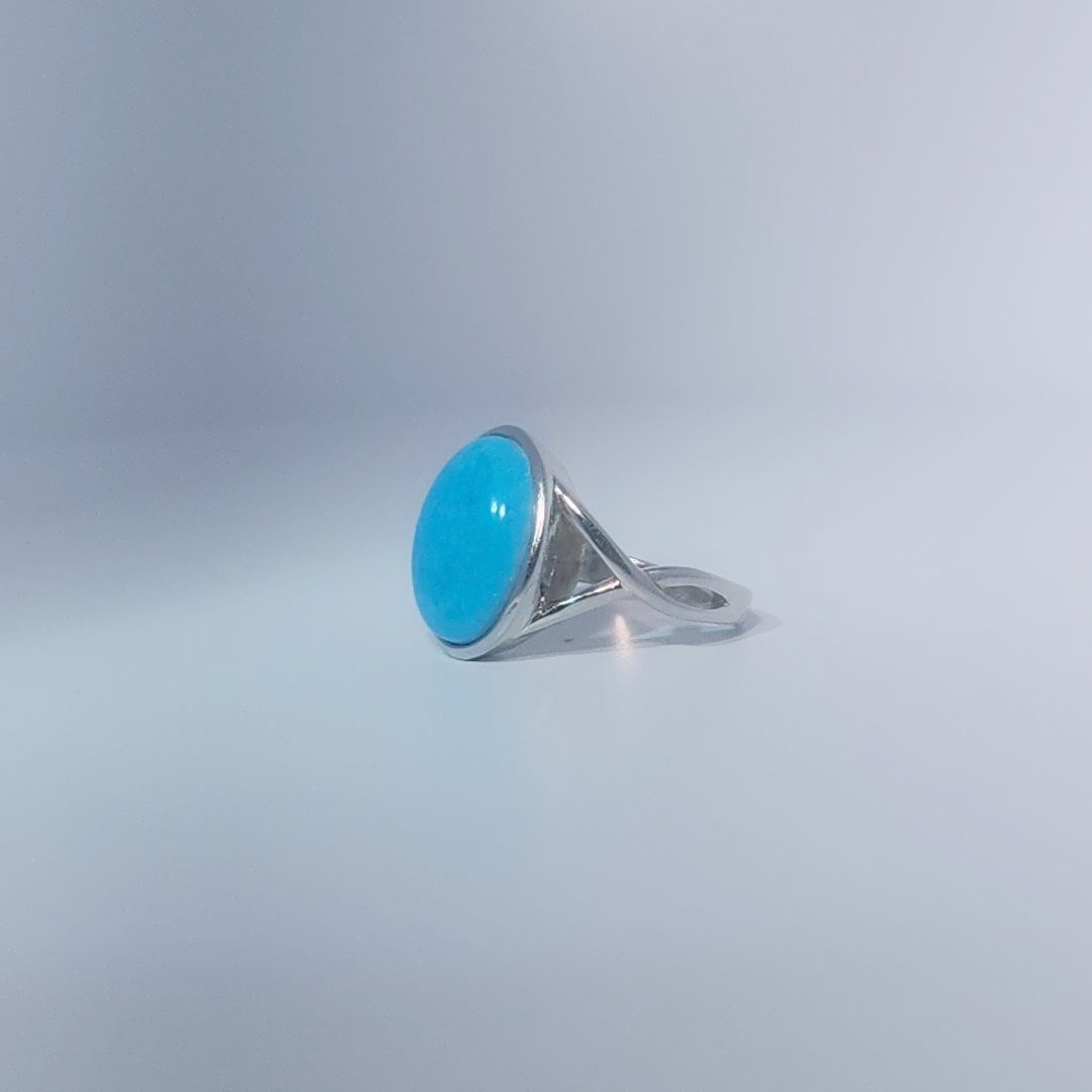 Women's ring with oval cabochon turquoise, set in 925 sterling silver band, size 7.