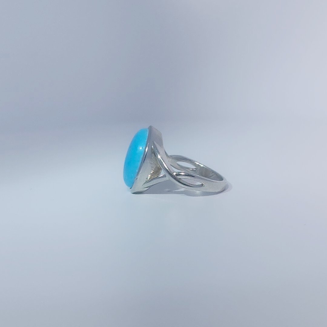 Women's ring with oval cabochon turquoise, set in 925 sterling silver band, size 7.