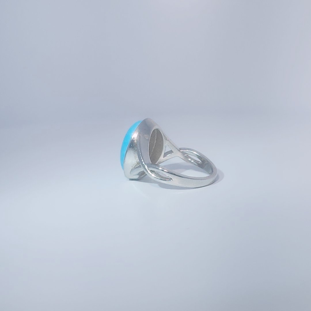 Women's ring with oval cabochon turquoise, set in 925 sterling silver band, size 7.