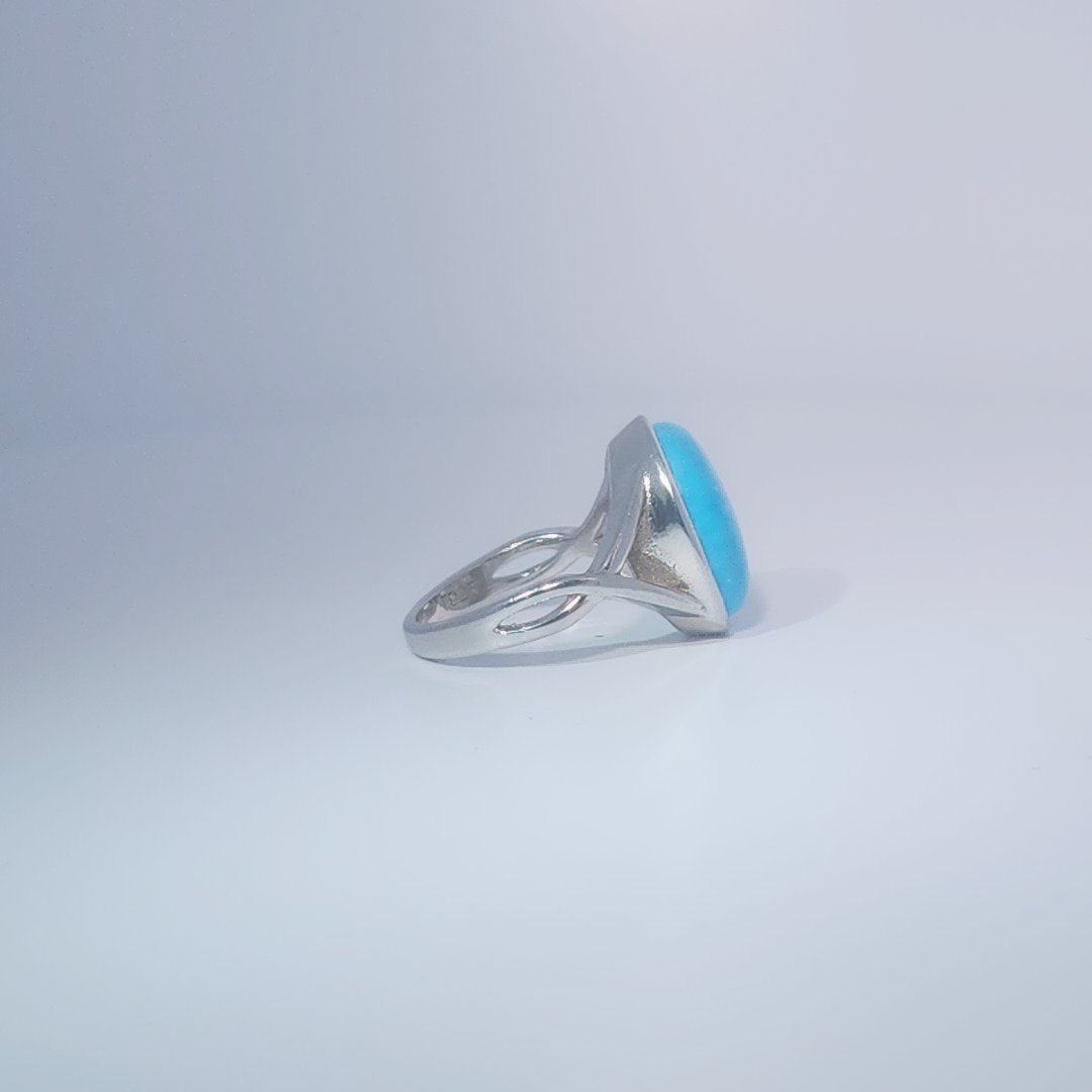 Women's ring with oval cabochon turquoise, set in 925 sterling silver band, size 7.