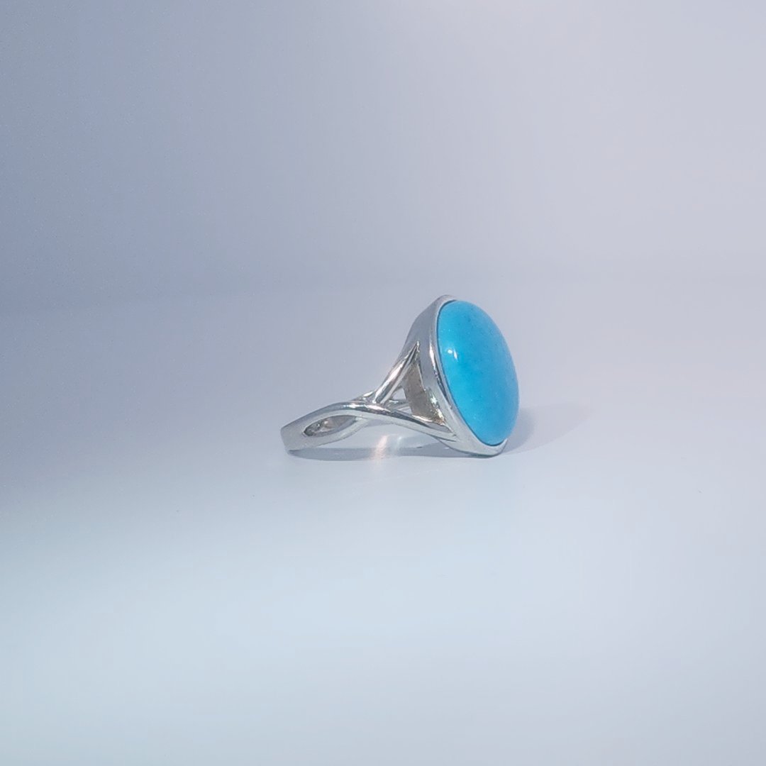Women's ring with oval cabochon turquoise, set in 925 sterling silver band, size 7.