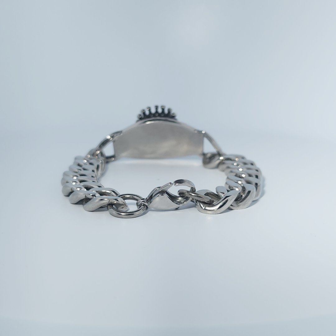 Male Stainless Steel Bracelet with a crowned skull and chain link design.