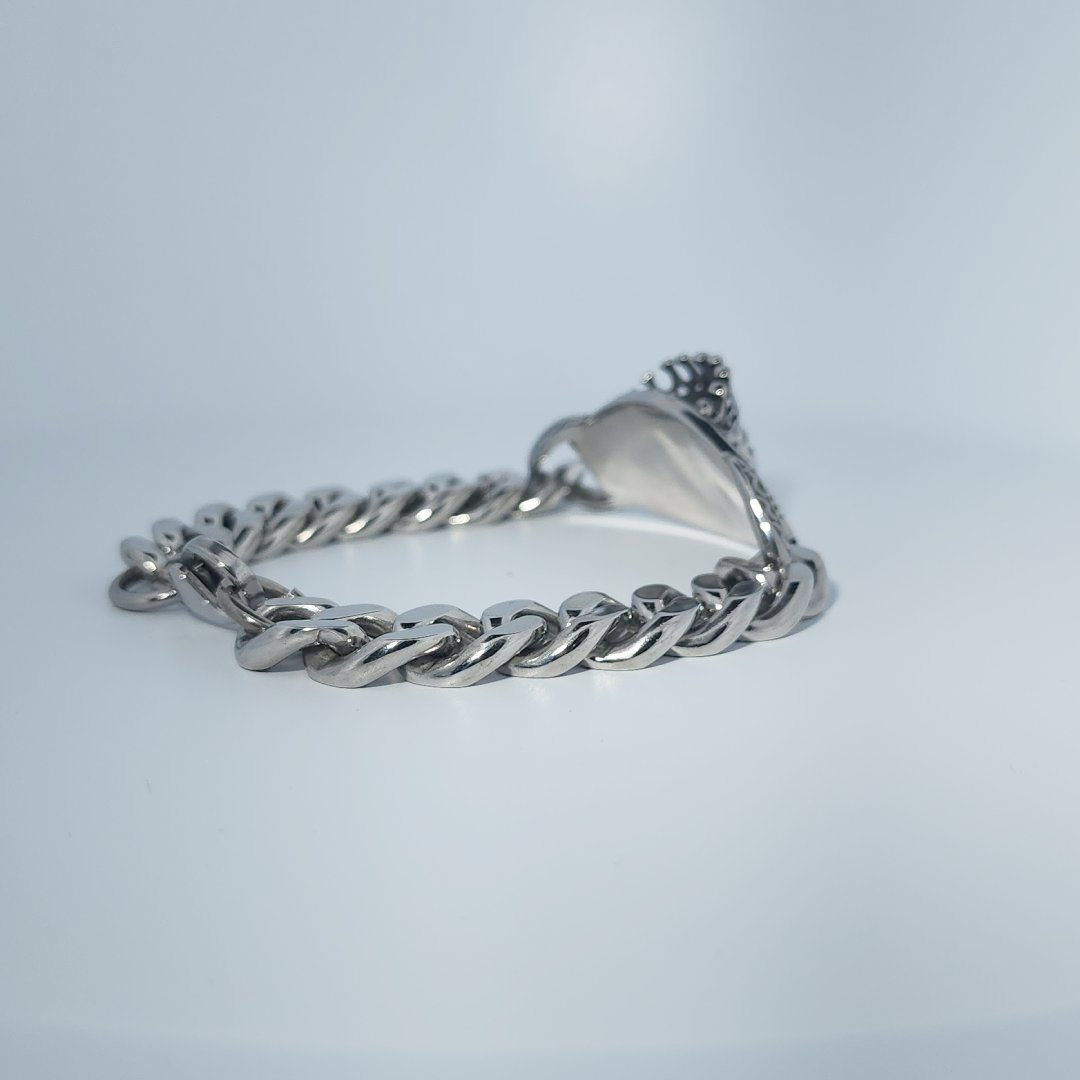 Male Stainless Steel Bracelet with a crowned skull and chain link design.