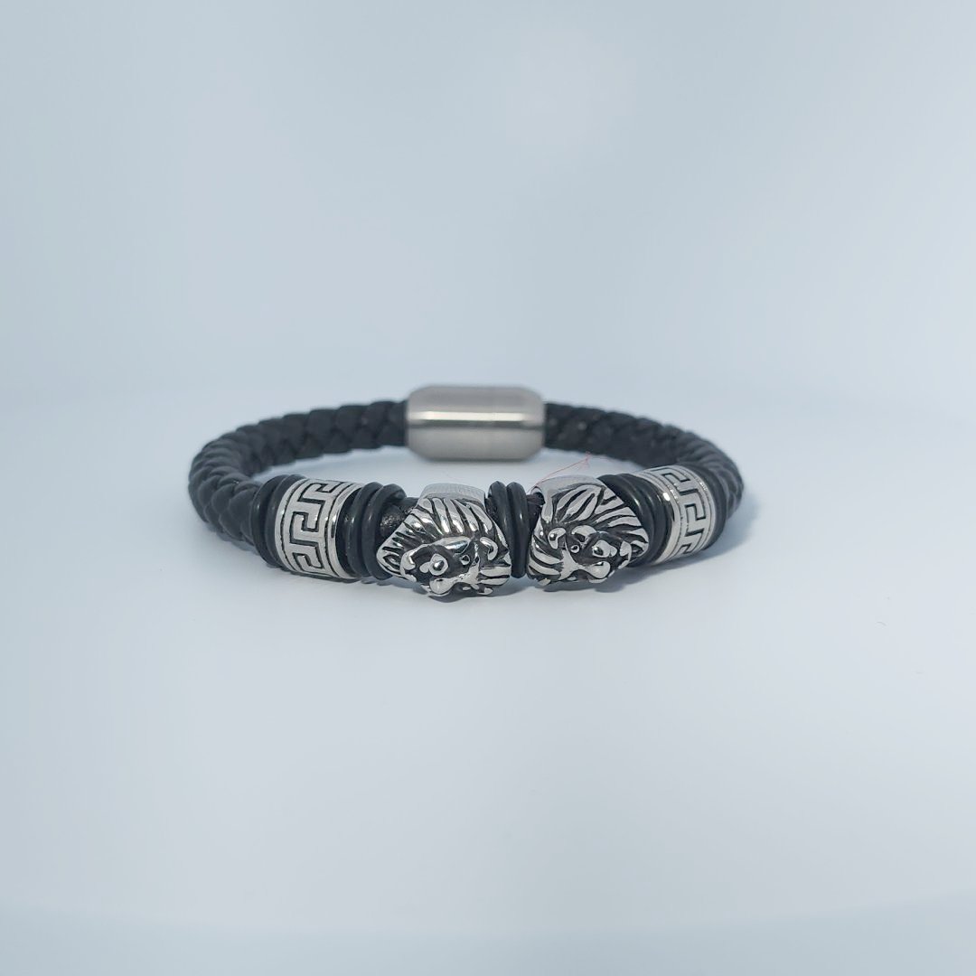 Black braided leather bracelet with stainless steel lion head and decorative tube accents, magnetic clasp, male style.