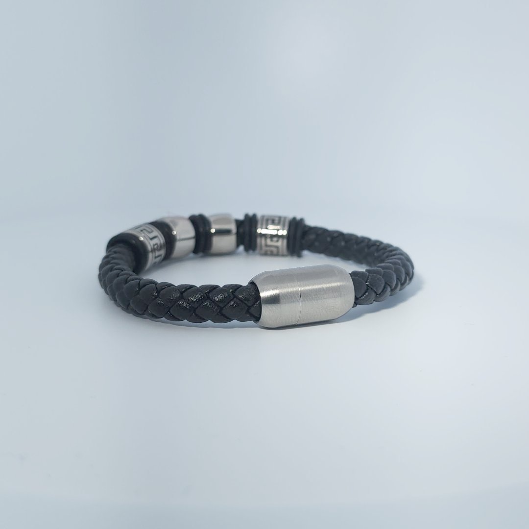 Black braided leather bracelet with stainless steel lion head and decorative tube accents, magnetic clasp, male style.
