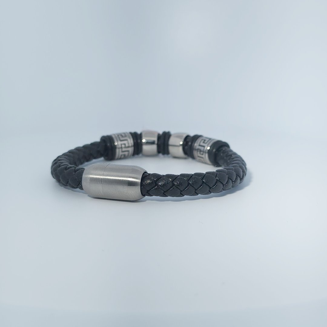 Black braided leather bracelet with stainless steel lion head and decorative tube accents, magnetic clasp, male style.