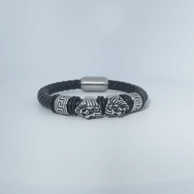 Black braided leather bracelet with stainless steel lion head and decorative tube accents, magnetic clasp, male style.