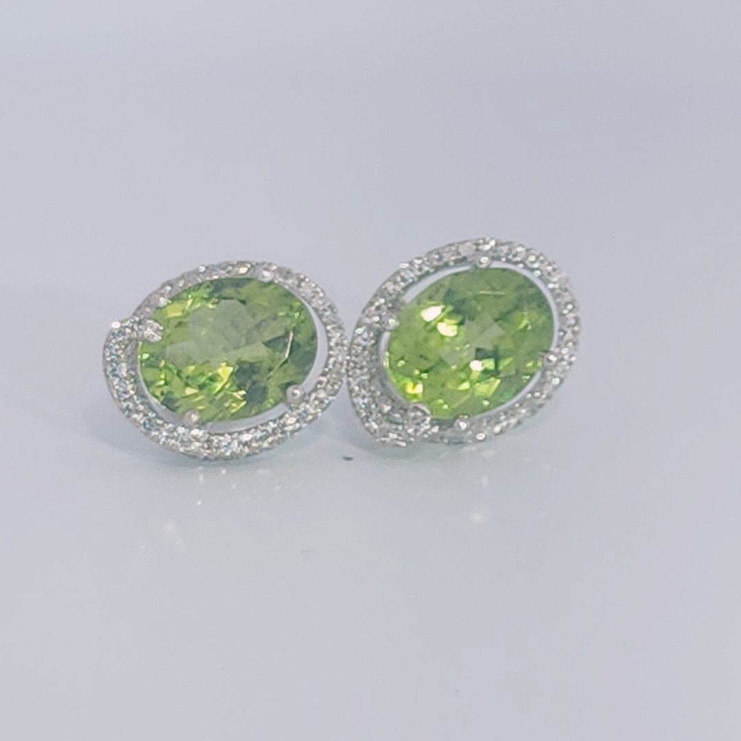 18K White Gold Earrings, set with 2 Oval Peridots (5ct total, Green, Loupe Clean) and Diamonds.