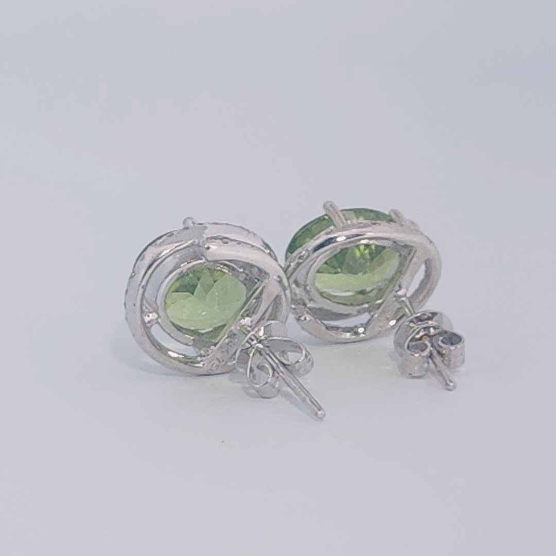 18K White Gold Earrings, set with 2 Oval Peridots (5ct total, Green, Loupe Clean) and Diamonds.