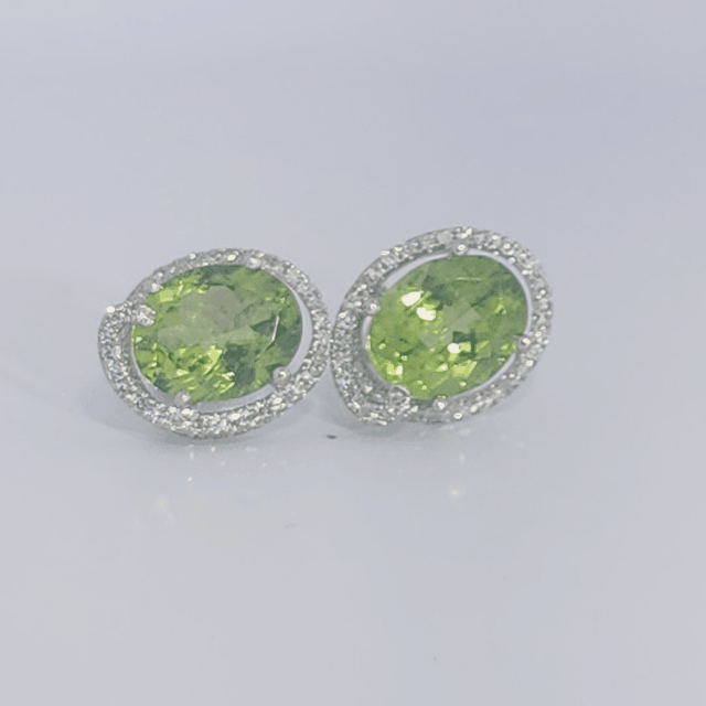 18K White Gold Earrings, set with 2 Oval Peridots (5ct total, Green, Loupe Clean) and Diamonds.