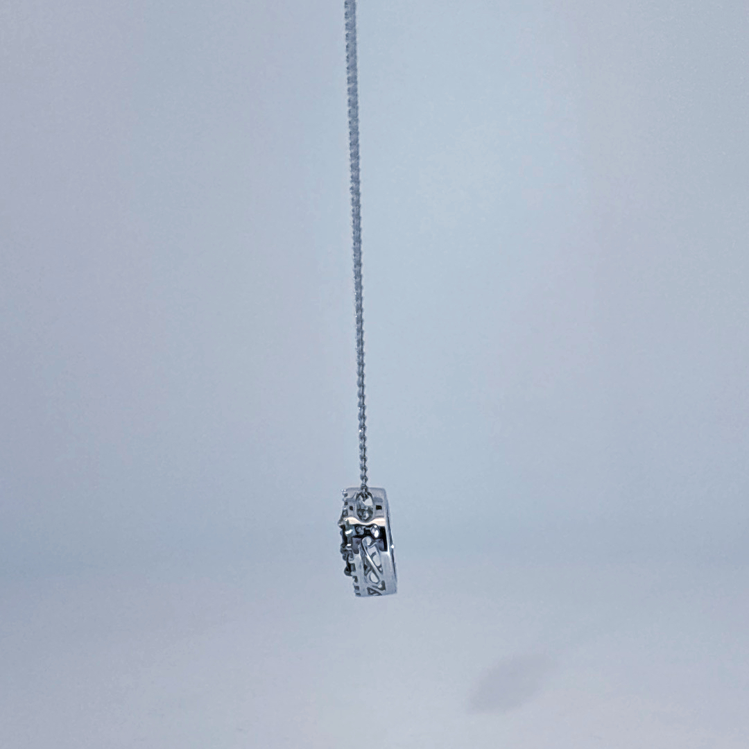 14K White Gold Necklace, set with 7 Blue Sapphires in a circular pendant surrounded by smaller clear stones.