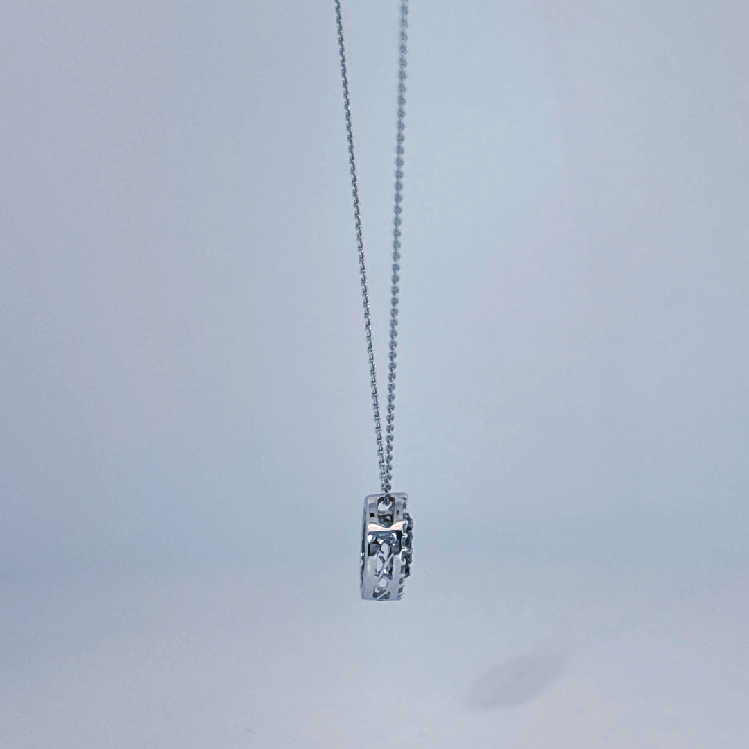14K White Gold Necklace, set with 7 Blue Sapphires in a circular pendant surrounded by smaller clear stones.