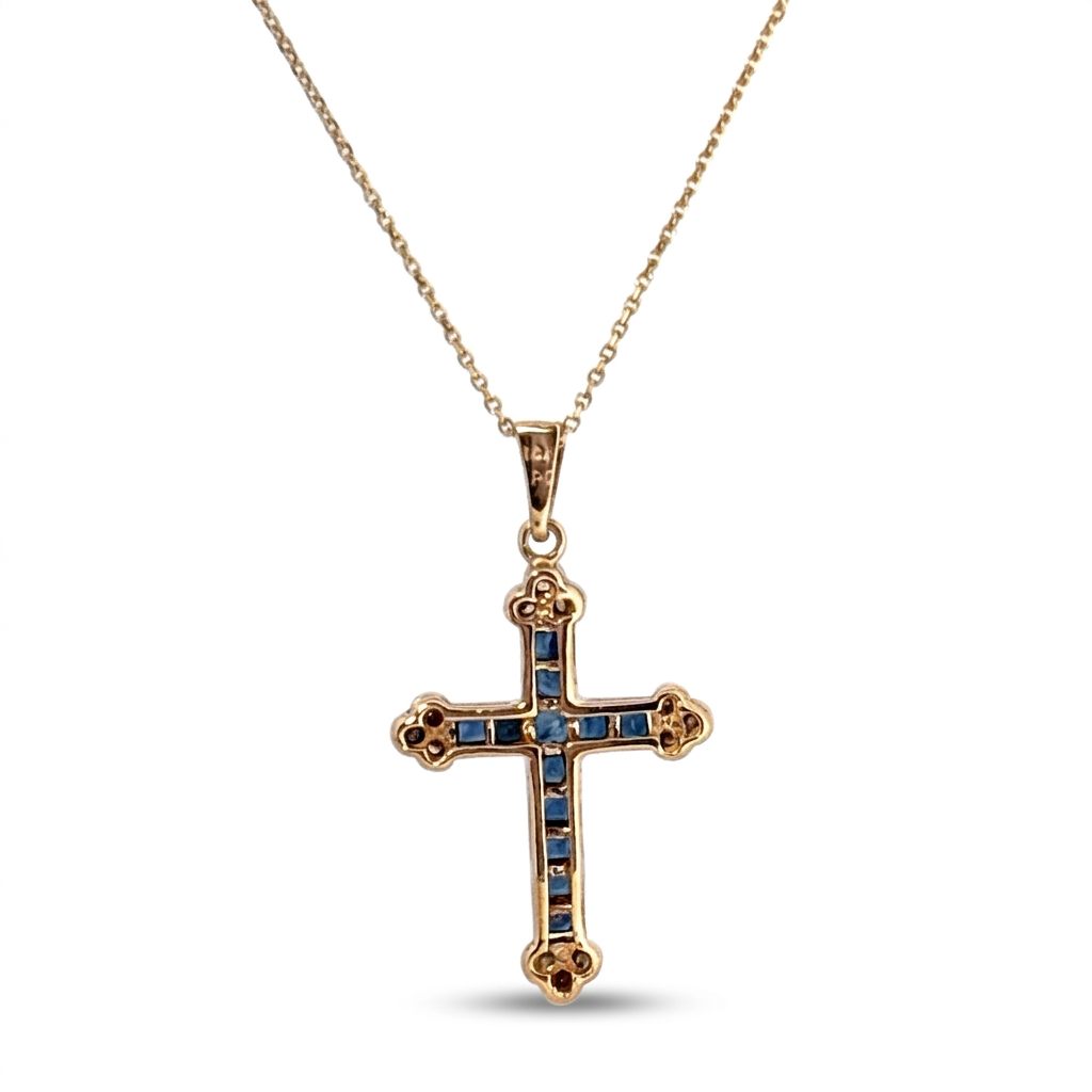 14K Yellow Gold Cross Necklace, set with 12 Blue Sapphire and 12 Diamond stones.