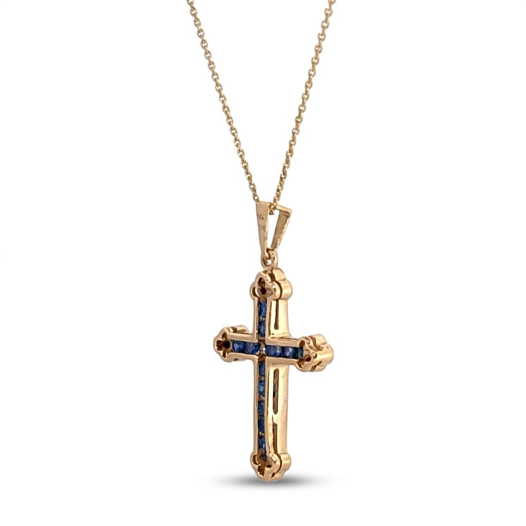 14K Yellow Gold Cross Necklace, set with 12 Blue Sapphire and 12 Diamond stones.