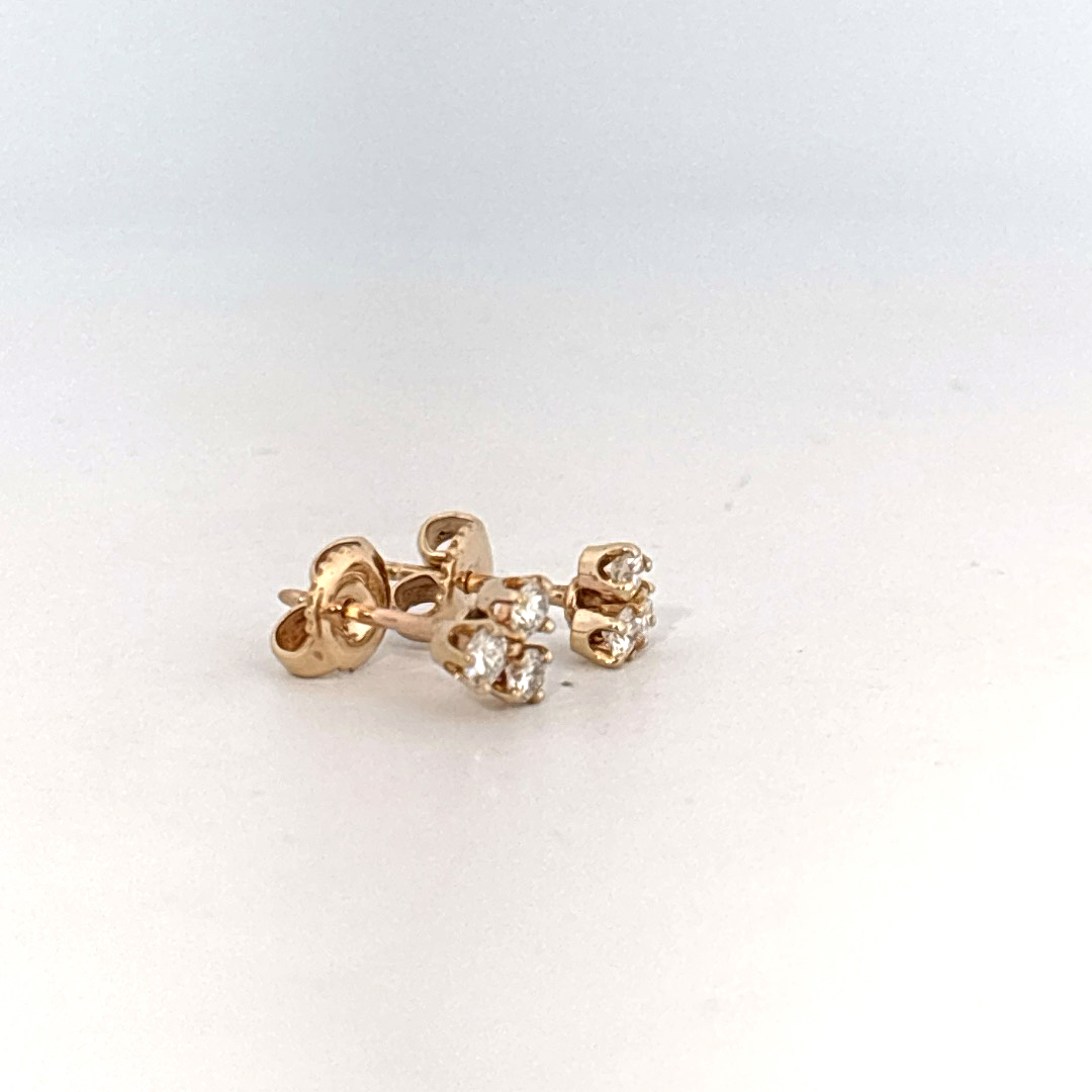 14K Yellow Gold Earrings set with 6 Round Brilliant Cut Diamonds totaling 0.18ct, E color.