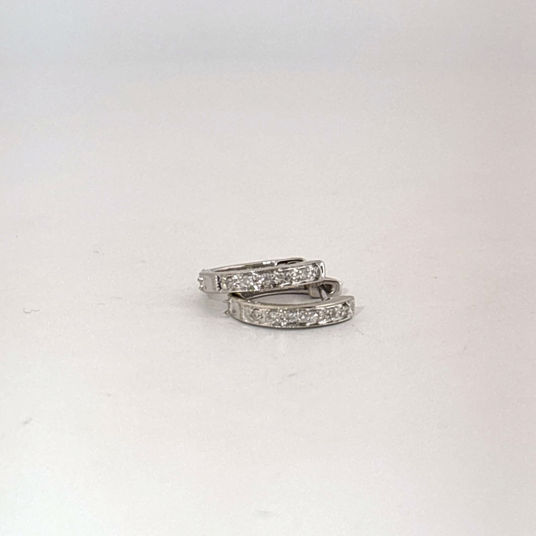 14K White Gold Diamond Hoop Earrings, female style, channel-set diamonds.