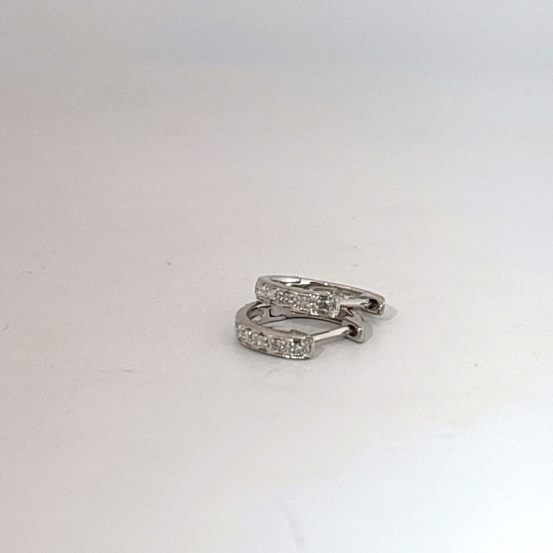 14K White Gold Diamond Hoop Earrings, female style, channel-set diamonds.